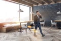 Businessman in gray loft cafe Royalty Free Stock Photo