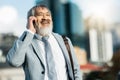 Businessman, smile and phone call in the city for communication, conversation or talking in the outdoors. Happy man Royalty Free Stock Photo