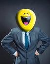 Businessman with smiley face instead of head