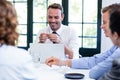 Businessman smiling in a business meeting Royalty Free Stock Photo