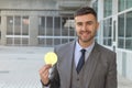 Businessman smiling while holding a Bitcoin Royalty Free Stock Photo