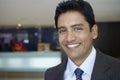 Businessman Smiling In Hotel Lobby