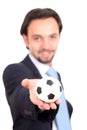 Businessman with a soccer ball balanced on finger Royalty Free Stock Photo