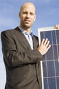 Businessman with solar panel Royalty Free Stock Photo