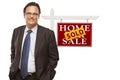 Businessman and Sold Home For Sale Real Estate Sign Isolated