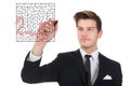 Businessman solving maze puzzle on transparent screen Royalty Free Stock Photo