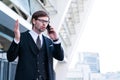 Businessman speaks by phone wave his hand in frustration. Royalty Free Stock Photo