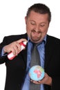 Businessman spraying a globe