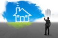 Businessman spraying house cloud sky grass paint covered gray ci Royalty Free Stock Photo