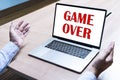 Businessman spread out your hands with message GAME OVER on display laptop Royalty Free Stock Photo