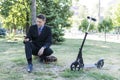 Businessman crouched down and uses the phone