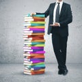 Businessman stack of books