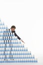 Businessman Stacking Plastic Cups Into Pyramid