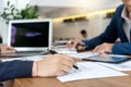 Businessman and staff working with computer on table Royalty Free Stock Photo