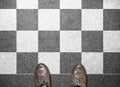 Businessman stand on chess tile floor Royalty Free Stock Photo