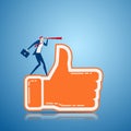 Businessman stand on thumb up sign using telescope looking for Positive feedback success, opportunities, future business trends. Royalty Free Stock Photo