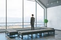 Businessman standinf in cozy attic interior room