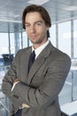 Businessman Standing Arms Crossed In Office Royalty Free Stock Photo