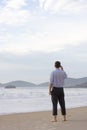 Businessman standing on beach Royalty Free Stock Photo