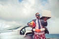 Businessman standing on a beach near car Royalty Free Stock Photo