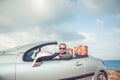 Businessman standing on a beach near car Royalty Free Stock Photo