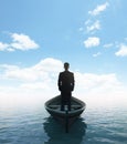 Businessman standing on a boat