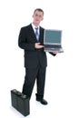 Businessman Standing With Briefcase And Open Laptop