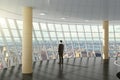 Businessman standing in a business center hall with city view Royalty Free Stock Photo