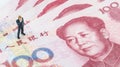 Businessman standing on the Chinese banknote