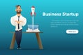 Businessman standing by the desk with a laptop. Business startup concept. Successful launch of Internet project