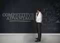 Businessman standing in front of a blackboard Royalty Free Stock Photo