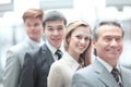Businessman standing in front of his business team on blurred office background Royalty Free Stock Photo
