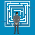 Businessman standing in front of a maze with a solution to succe