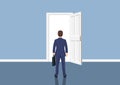 Businessman standing in front open doors. Royalty Free Stock Photo