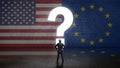 Businessman standing in front of a wall with a questionmark and the flags of the usa and the european union