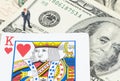 Businessman standing on the gamble card with US dollar Royalty Free Stock Photo