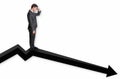 Businessman standing on a graph and looking down on the results Royalty Free Stock Photo