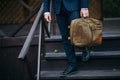 Businessman standing and holding a briefcase in hand working with confidence Royalty Free Stock Photo