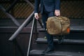 Businessman standing and holding a briefcase in hand working with confidence Royalty Free Stock Photo