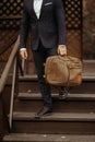 Businessman standing and holding a briefcase in hand working with confidence Royalty Free Stock Photo