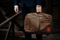 Businessman standing and holding a briefcase in hand working with confidence Royalty Free Stock Photo