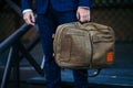 Businessman standing and holding a briefcase in hand working with confidence Royalty Free Stock Photo