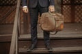 Businessman standing and holding a briefcase in hand working with confidence Royalty Free Stock Photo