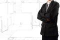 Businessman standing near a House blueprints Royalty Free Stock Photo