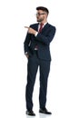 Businessman standing one way and pointing aside happy Royalty Free Stock Photo