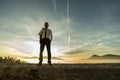 Businessman standing outdoors with his jacket over his shoulder Royalty Free Stock Photo