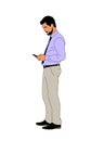 Business man standing with phone full length.