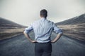 Businessman standing on the road. long way to go concept Royalty Free Stock Photo