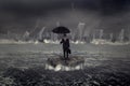 Businessman standing on the sea with crisis storm