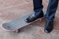 Businessman standing on skateboard Royalty Free Stock Photo